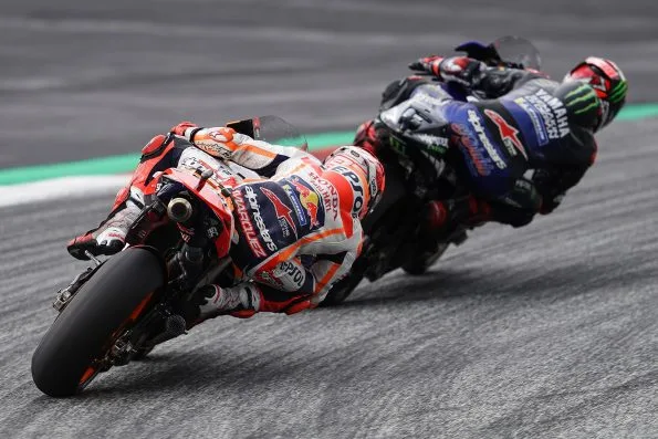 Fabio Quartararo, riding his Monster Energy Yamaha, being followed by the Repsol Honda of Marc Márquez at the 2021 Austrian Grand Prix.
