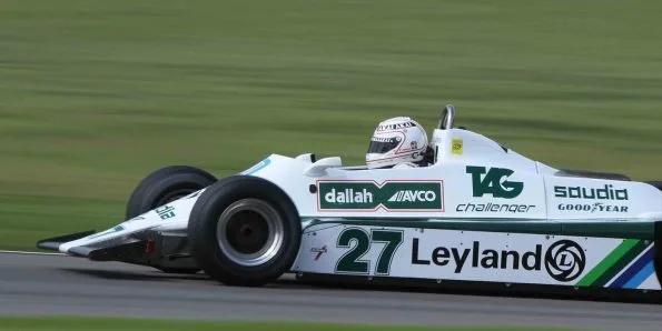 A Williams FW07 Formula 1 car on track in Saudia-Leyland colours
