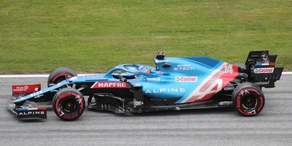 Fernando Alonso driving the Alpine A521 in blue at the 2021 Austrian Grand Prix