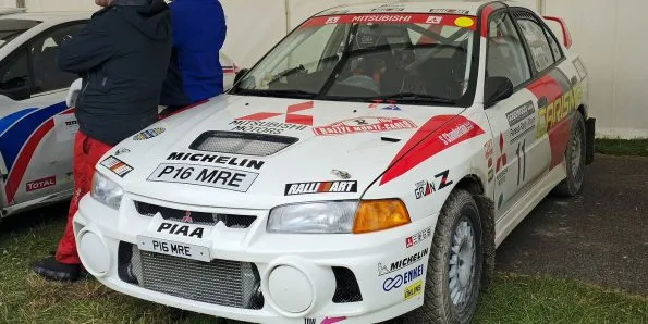 Mitsubishi Lancer Evolution rally car in white and red Ralliart livery