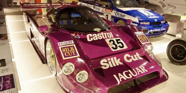 Jaguar XJR-12 Group C car in Silk Cut purple, front three-quarter view
