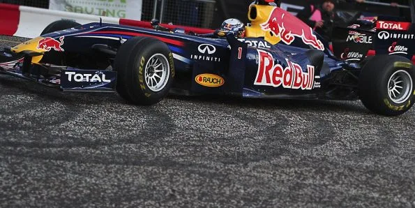 A Red Bull Formula 1 car with Sebastian Vettel at the Red Bull Home Run event in 2011