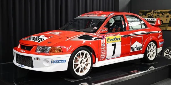 Mitsubishi Lancer Evolution rally car in red and white Marlboro livery, number 7