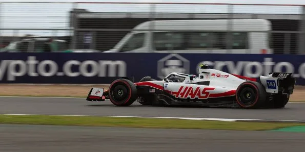 Mick Schumacher driving the Haas VF-22 in white and red at the 2022 British Grand Prix