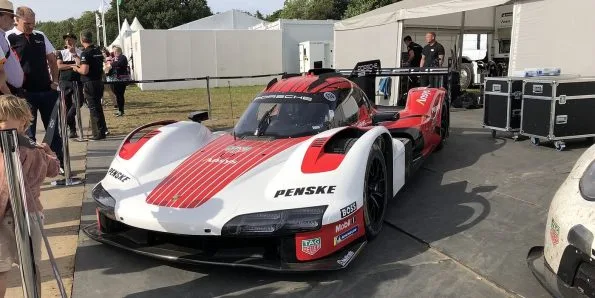 Porsche 963 LMDh endurance prototype in white and red