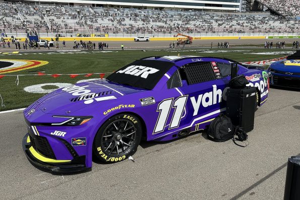 Denny Hamlin's purple number 11 Joe Gibbs Racing Toyota Camry on pit road at Las Vegas Motor Speedway.