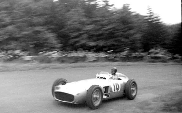 Mercedes-AMG historic Silver Arrows era: Juan Manuel Fangio driving the Mercedes-Benz W196 racing car at the 1954 Grand Prix.