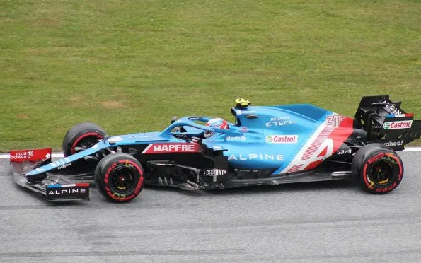 BWT Alpine Esteban Ocon driving in side profile at the 2021 Austrian Grand Prix