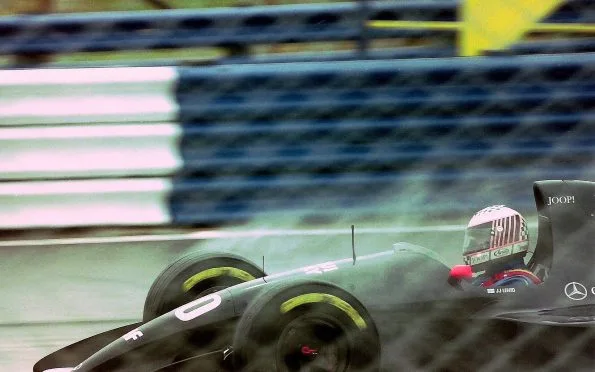 Audi historical background showing JJ Lehto driving the Sauber C12 during practice for the 1993 British Grand Prix at Silverstone.