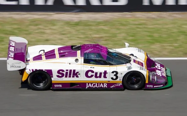 Silk Cut Jaguar XJR-9 number 3 in purple and white racing on track during the Le Mans 24 Hours