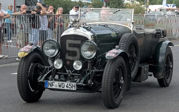 Bentley Motors classic Speed Six model displayed at a heritage motorsport event during the brand's racing hiatus.