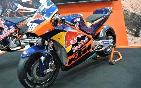 Red Bull KTM Factory Racing RC16 prototype motorcycle on display featuring the iconic orange livery and race sponsor decals.