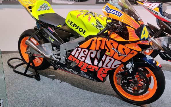 Honda HRC RC211V four-stroke MotoGP racing motorcycle featuring the 2003 Valencia team livery