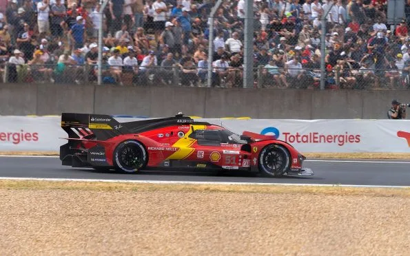 Ferrari AF Corse red and yellow 499P Hypercar winning the 24 Hours of Le Mans endurance race