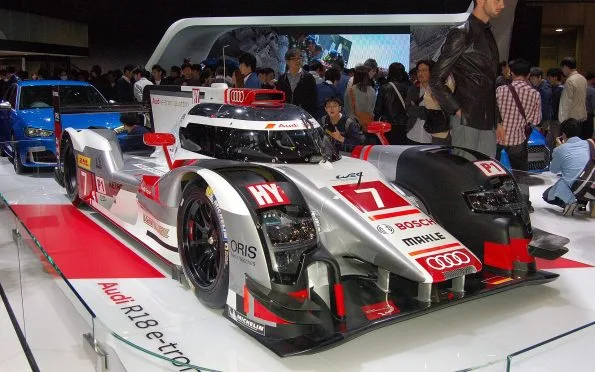 Audi Sport Team Joest Audi R18 e-tron quattro hybrid Le Mans prototype racing car on display in the final endurance era.