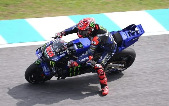 Yamaha Factory Racing Monster Energy YZR-M1 modern MotoGP race bike being ridden on track during recent premier-class rebuilding seasons.