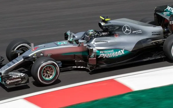 Mercedes-AMG dominant hybrid era: Nico Rosberg driving the championship-winning W07 Formula 1 race car on track.