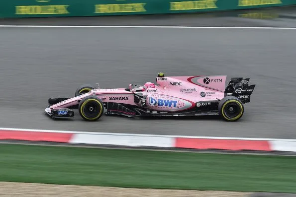 Esteban Ocon in the pink Force India car on track in China.