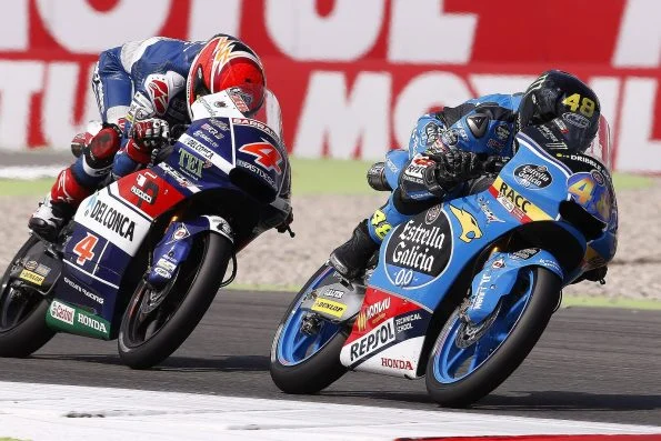 Fabio Di Giannantonio and Lorenzo Dalla Porta racing their Moto3 machines side by side at the Dutch Grand Prix.