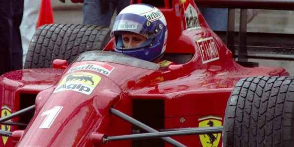 Alain Prost in the cockpit of his Ferrari 641 after wet qualifying at the 1990 United States Grand Prix in Phoenix