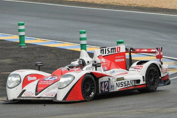 Jann Mardenborough driving the #42 Greaves Motorsport Zytek Z11SN-Nissan LMP2 in white and red Nismo livery at Le Mans.
