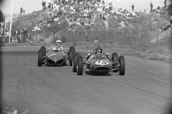 Jim Clark in his number 15 Lotus 21 alongside Phil Hill in a Ferrari at Zandvoort in 1961