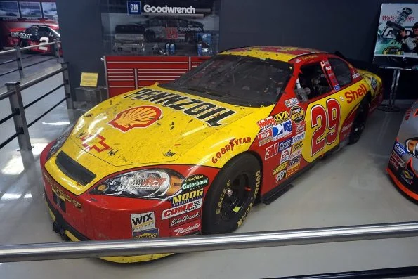 Kevin Harvick's yellow and red number 29 Pennzoil Chevrolet Monte Carlo, the car in which he won the 2007 Daytona 500, on museum display.