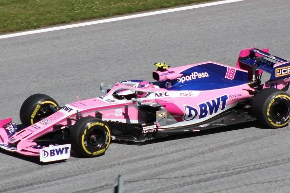 Lance Stroll in the pink Racing Point car, number 18, on track in Austria.