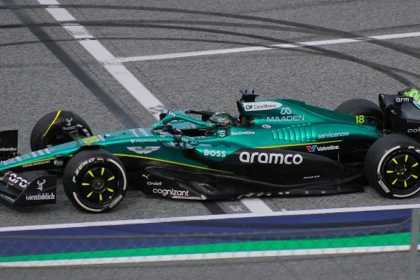 Lance Stroll in the green Aston Martin, number 18, on track in Austria.