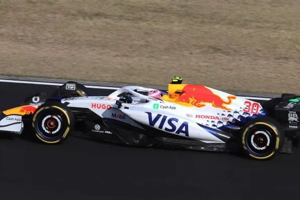 Liam Lawson in the white and blue Racing Bulls car, number 30, on track at Suzuka.