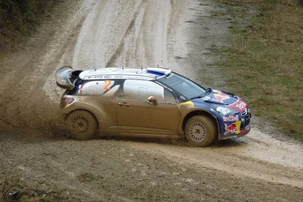 Sébastien Ogier driving the Citroën DS3 WRC on gravel at Rally Australia in 2011