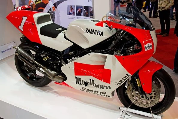 Wayne Rainey's iconic number 1 white and red Marlboro Team Roberts Yamaha YZR500 showcased on a display plinth.