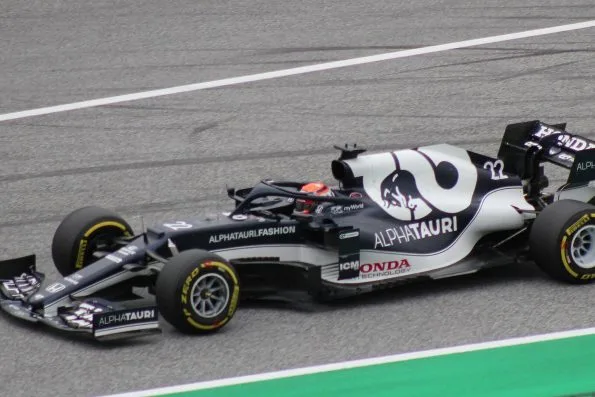 Yuki Tsunoda in the white and navy AlphaTauri, number 22, on track in Austria.
