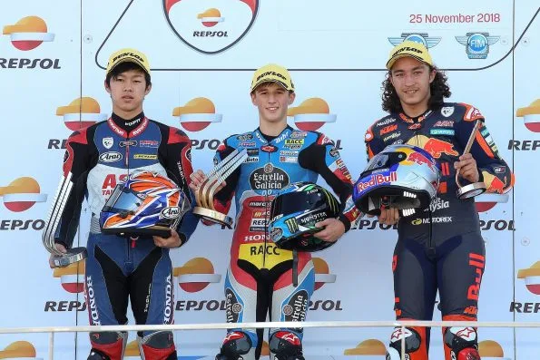 Ai Ogura on the Moto3 podium of the 2018 CEV Valencia round, alongside Sergio García and Can Öncü.