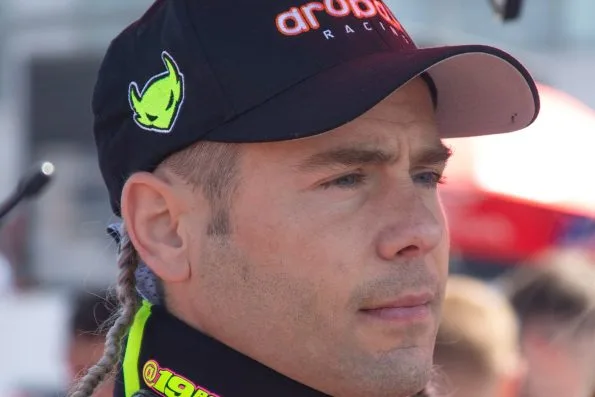Álvaro Bautista in an Aruba Racing cap and Ducati team collar at Donington Park during the 2022 Superbike World Championship