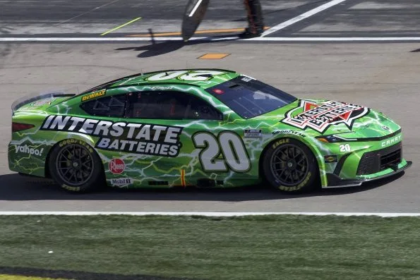 Christopher Bell's green Interstate Batteries No. 20 Joe Gibbs Racing Toyota on track at Las Vegas Motor Speedway in 2024.