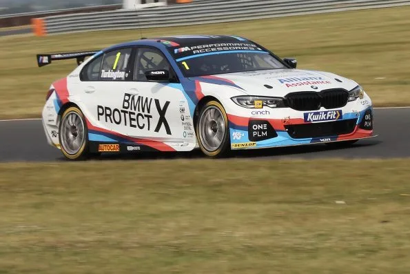 Colin Turkington in the number 1 Team BMW 330i M Sport at a Snetterton tyre test in July 2019, in white, red and blue BMW Protect livery.
