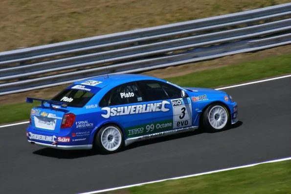The blue number 3 Silverline Chevrolet of Jason Plato, his name above the door, at Clay Hill at Oulton Park during the 2009 British Touring Car Championship.