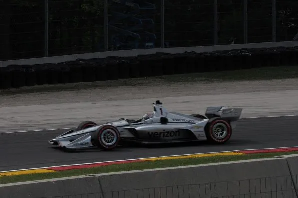 Josef Newgarden in the white and blue Verizon Team Penske Dallara, carrying number 1 as reigning champion, running practice laps for the 2018 Kohler Grand Prix at Road America.