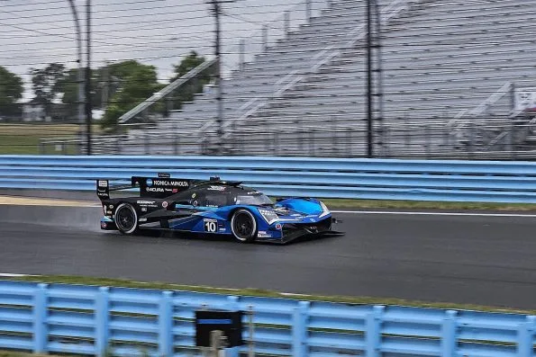 The Wayne Taylor Racing Acura ARX-06 GTP driven by Ricky Taylor, Filipe Albuquerque and Louis Delétraz, in practice for the 2023 Six Hours of the Glen.