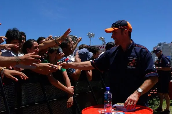 Stéphane Peterhansel signing autographs for spectators at Buenos Aires before the 2010 Dakar Rally.