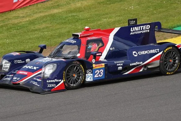 The dark blue and red United Autosports Oreca 07 LMP2 car, number 23, in free practice at Spa-Francorchamps in 2023, with Tom Blomqvist's name printed above the door.